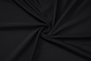 Vue macro détaillée de la texture du tissu en maille noire élastique et nervurée