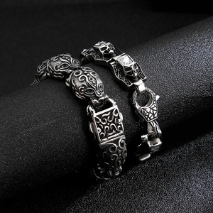 Detail of vintage silver skull and beast head titanium steel bracelet for men