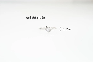 Detail view of bypass moissanite ring with 1.5g weight and 5.7mm height specs