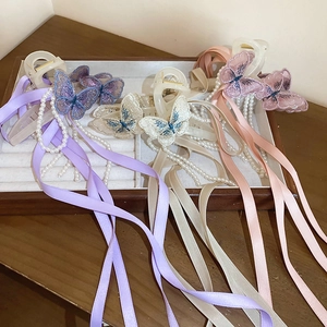 Pinces à cheveux papillon élégantes avec glands en perles et longs rubans de satin en trois couleurs