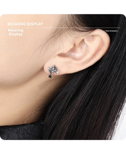 Wearing display of vintage S925 sterling silver bow knot earrings with oxidized finish