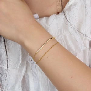 Elegant s925 sterling silver gold-plated double-layer bracelet with zircons on a female wrist