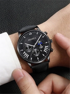 Close-up of men's black leather watch with moon phase dial and chronograph features