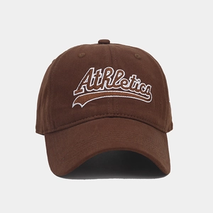 Detail of Athletics embroidery on brown cotton baseball cap with vintage finish