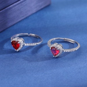 Silver adjustable ring with red heart-shaped zircon and pavé diamonds on blue velvet