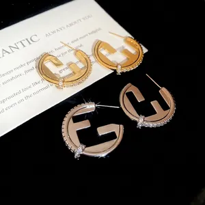 Luxury 18K gold plated C-shaped earrings with F-letter hollow design and pave zircons