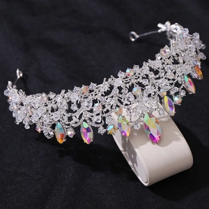 Detailed close-up of a silver baroque crown featuring sparkling AB rhinestones and crystals