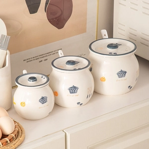 Three-piece ceramic seasoning jar set with lids and spoons, blue kitchen pattern design