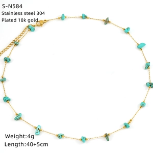 Detailed view of turquoise stone fragments on a 304 stainless steel 18k gold plated chain