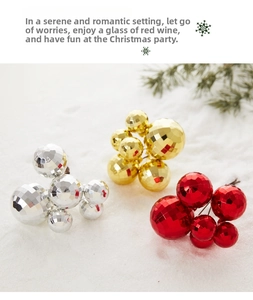 Close-up of faceted reflective Christmas ball clusters in silver, gold, and red
