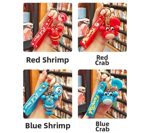 Detailed close-up of cartoon crab and lobster keychains with silicone wrist straps