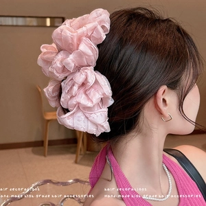 Elegant large pink layered organza bow hair claw clip for a voluminous fairy hairstyle