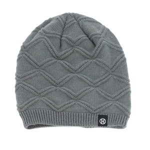 Close-up of grey knit beanie featuring warm fleece lining and textured diamond weave pattern
