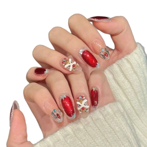 Rote Cat-Eye-Nägel zum Aufkleben mit Silberglitzer, weißen Schleifen und festlichen Motiven