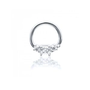 Macro shot of silver body piercing ring featuring square and round cubic zirconia stones