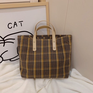 Vintage plaid woven tote bag with brown checkered pattern and leather handles