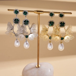 Elegant double-layered butterfly earrings with rhinestones and white pearl tassels