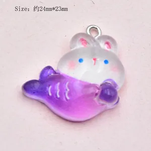 Detail view of a 24mm purple gradient resin rabbit fish charm with metal ring
