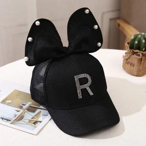 Detail of black mesh baseball cap featuring a large bow, pearls and rhinestone letter R