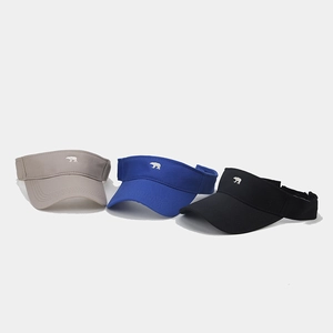 Detail of three colorful sun visors with climbing bear embroidery for outdoor sports