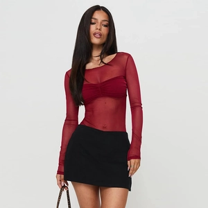 Close-up of red sheer mesh long sleeve top and black mini skirt for a sexy slim fit