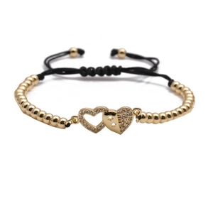 Adjustable gold bead bracelet featuring interlocking hollow heart and star pattern charms
