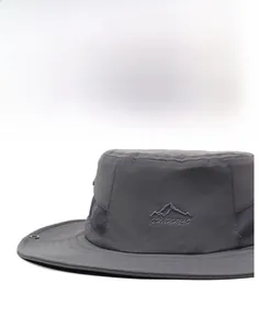 Detail of dark grey sun hat featuring breathable side mesh and wide structured brim