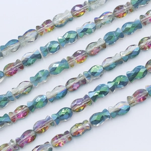 Macro detail of faceted crystal fish beads with iridescent AB coating for jewelry DIY