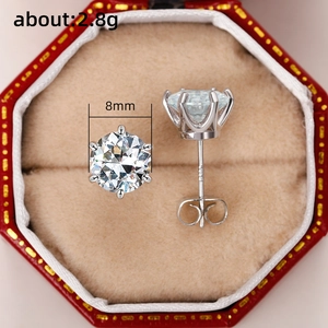 Macro shot of 8mm classic six-prong zircon stud earrings with 2.8g weight markers