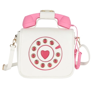 Retro telephone style crossbody bag in white and pink with heart dial and gold hardware