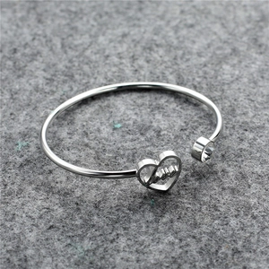 Minimalist silver stainless steel open heart bracelet with Love engraving and crystal