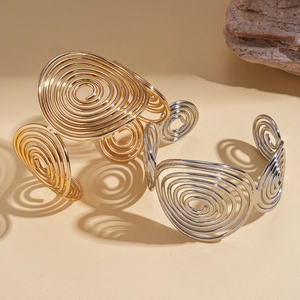 Exaggerated geometric spiral metal open bangle in gold and silver finish for women
