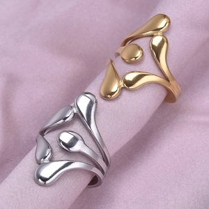 Minimalist 304 stainless steel liquid drip ring in gold and silver finish on pink fabric