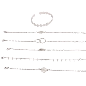 Detail view of a 5-piece silver bracelet set featuring butterfly and crescent charms