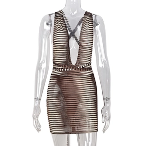 Detail of the deep V-neckline and crisscross back straps on this striped mini dress