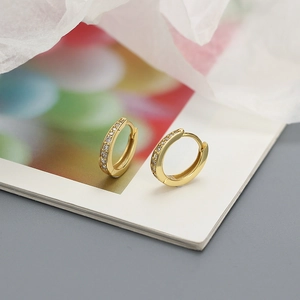 Detailed view of gold plated S925 silver hoop earrings with sparkling zircon stones