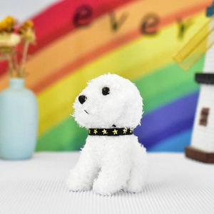 Detail shot of a cute white plush teddy dog pendant with a gold star black collar.