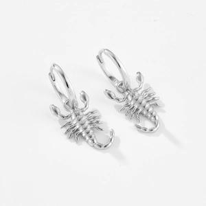Detailed macro view of S925 sterling silver scorpion earrings with authentic hallmark