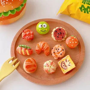 Cute resin food pins featuring realistic burgers and croissants on a wooden tray