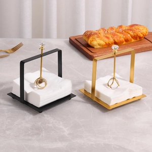 Modern metal square napkin holder with crystal weighted arm in black and gold finish