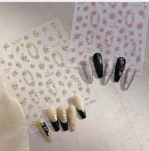 Detail of M-891 nail stickers showing gold embossed floral patterns on fake nails