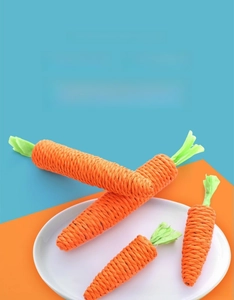 Detail of four woven carrot cat toys showing durable cotton rope textures and green leaves
