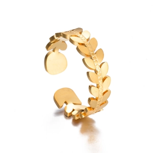 Macro view of gold laurel wreath ring with detailed leaf patterns and polished finish