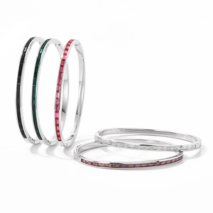 Luxury stainless steel bangles set with colorful baguette-cut stones on white background