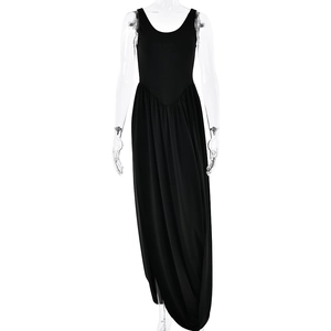 Sleeveless black backless maxi dress with U-neckline and side slit on mannequin