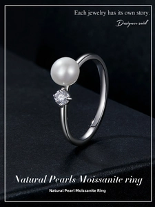 Macro detail of elegant S925 silver ring featuring a natural pearl and moissanite stone