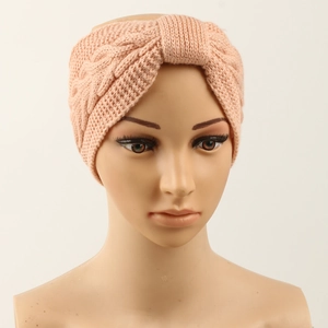 Detailed knit texture and twisted knot design of the pink winter fleece hairband