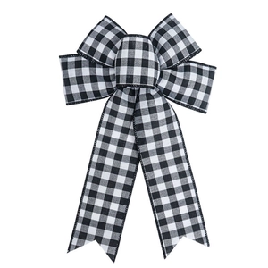Detail of buffalo plaid bow ornament with black and white gingham fabric texture