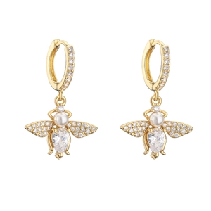 Macro view of bee-shaped drop earrings with pavé zircons and pear-shaped stones