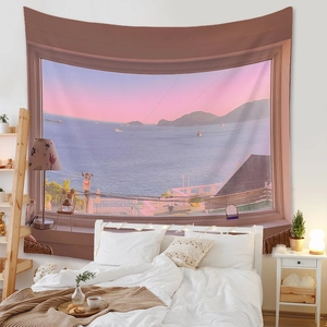 Detail of bohemian tapestry featuring a sunset sea view window effect in a cozy bedroom
